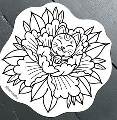 a sticker with a cat sitting on top of a flower