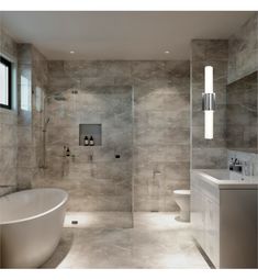 a bathroom with a tub, sink and toilet in it's center wall is shown