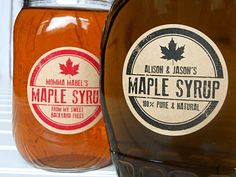 two maple syrups are sitting next to each other