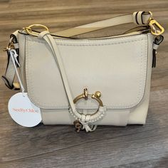 See By Chloe Joan Small Hobo Leather Handbag Cement Beige Nwt Msrp $620 Brand New Never Worn With Tags And Card Adjustable Removable Crossbody Strap, 21" Drop Removable Top Handle, 6.5" Drop Dimensions: 11.75"W X 5.5"D X 7.8"H Zip Closure Exterior Flap Pocket, Interior Zip Pocket, Two Interior Slip Pockets Signature Woven Leather And Ring Hardware Detail At Front Gold-Tone Hardware Mannequin Model Measurements: 5'10" Height, Wearing A Size 4 Or Small Polyester Lining Leather Imported Accepting O Cream Shoulder Bag With Metal Hardware, Cream Bags With Metal Hardware For Everyday Use, Cream Crossbody Shoulder Bag With Branded Hardware, Cream Satchel With Branded Hardware For Everyday Use, Chloe Mini Bag, See By Chloe Joan, Mannequin Model, Chloe Shoulder Bag, Unique Handbag