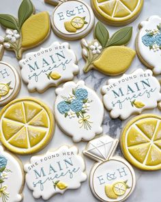 decorated cookies in the shape of lemons and oranges