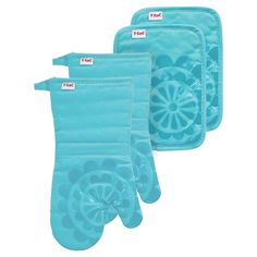 three oven mitts are shown with labels on them