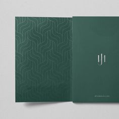 the front and back cover of a book with an abstract pattern on it, in green