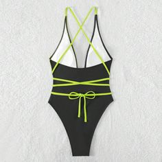 Elevate your beachside allure with our sleek and seductive one-piece swimsuit. Crafted with a minimalist design, this swimsuit features sensual straps that accentuate your curves with an air of sophistication. The premium fabric offers comfort and support while ensuring a flattering fit. Whether lounging by the pool or strutting on the sands, this swimsuit embodies pure elegance and confidencePattern: Solid colorWith or without steel support: With padded cups, no underwireColor: BlackSize: S, M, Dance Sports, Sports Swimming, Swimsuit Pattern, Pure Elegance, Sports Fashion, Black Swimsuit, Premium Fabric, The Pool, Sport Fashion