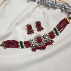 Sabyasachi Inspired Antique Victorian Kundan Ruby Doublet Diamond Necklace Set/Elegant Jewelry Set/Next to Real Set/Indian Jewelry/Pakistani * Necklace Length: Choker length (comes with adjustable sarafa/dori/cord) * Earrings Length: 1.25 inches approx * Material: Brass and stone * Package: Necklace and Earrings STYLE TIP: The Look Is Stunning And Perfectly Suitable For All Kinds Of Dressy Occasions. Wear with an ethnic outfit for any occasion. This traditional set can complement any Internation Traditional Heavy Choker For Formal Occasions, Elegant Festive Choker With Zari Work, Traditional Festive Choker For Formal Occasions, Traditional Festive Formal Choker, Formal Traditional Choker, Formal Festive Traditional Choker, Elegant Festival Choker With Zari Work, Elegant Choker With Latkans For Festive Occasions, Elegant Zari Work Choker For Festivals