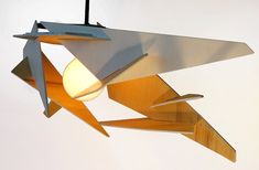 a wooden light fixture hanging from a ceiling