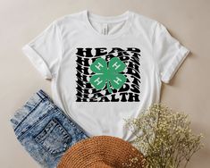 "Retro 4-H Life Tshirt, Wavy 4-H Life Shirt, Hands Head T-shirt, 4-H New Design Tshirt, 4H Shirt, St Patricks Day Shirts, Retro 4-H Life Tees HI! Welcome to my shop, I'm pleased to see you here. My shop's main aim is to make you happy. I see you as a friend, not just a customer. Please contact me if you have any questions or want to get a custom-made design. I'm sure you'll love my designs. If you liked the design but didn't like the tshirt color we have, please contact me. I will do my best to make you satisfied. ** HOW TO ORDER SHIRT ** 1- Please, Check and Review all Photos. 2- Select Your T-Shirt Size and T-Shirt Color from drop down menus. 3- Enter your Design Color 4- Choose Your Quantity as much as you want. 5- Click ADD TO CART. And, you can go back to add more product color for yo 4h Club Shirts Design Ideas, 4h Shirt Ideas, 4-h Shirt Ideas, 4-h Shirts, 4-h Tshirt Ideas, 4h Designs, 4 H Shirts Designs Ideas, 4h Shirts Design Ideas, 4h Shirts