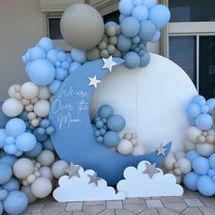 a balloon arch with stars and moon on it