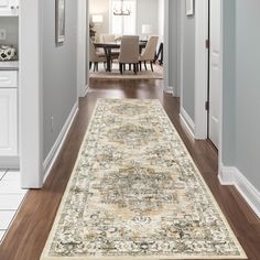 a large area rug is in the middle of a hallway