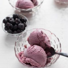 three bowls filled with ice cream and berries