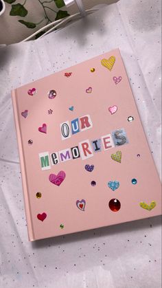 Large pink hardcover scrapbook with newspaper letters reading our memories. Our Scrapbook, Memories Album Aesthetic, School Memory Journal, Memory Dairy Ideas, Scrapbook Mothers Day, Memory Book Aesthetic Ideas, Memories Book Cover Ideas, Photo Album Front Cover Ideas, Cute Memory Book Ideas