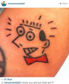 a close up of a person's arm with a tattoo on it that has an image of a dog wearing a bow tie