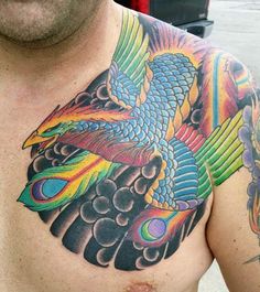 a man with a colorful tattoo on his chest