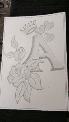 a drawing of the letter a with flowers and hearts