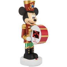 a mickey mouse figurine holding a clock with the time on it's display