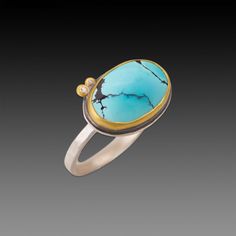 This lovely ring features a smooth, oval, blue turquoise, veined with delicate, intriguing inclusion patterns. The stone is wrapped in warm 22k gold and accented with a pair of sparkling diamonds set in 22k gold. Sterling silver back and 2mm hammered band. Setting measures approximately 3/8 inch x 5/8 inch. Matte finish. Hammered Band, Lovely Ring, Green Turquoise, Blue Turquoise, Sparkle Diamonds, 22k Gold, Turquoise Blue, Turquoise Ring, Special Events