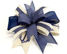 a blue and white bow with an anchor on it