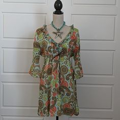 Linen Beach Mini-Dress In An Oversized Paisley Print Nwot - Never Worn Paisley Is Blue, Brown, Green And Red. Very Lightweight - Would Make A Great Beach Cover-Up That You Can Wear As A Dress For A Casual Dinner Gathers And Ties Up Under The Bodice V-Neck Lined With Ruffles Bell Sleeves Generous Size Small 21" Pit To Pit 20" Flat Across The Lower Bodice Wear The Ties Gather 34" Shoulder To Hem Casual Paisley Print Beach Cover-up Dress, Casual Paisley Print Dress For Beach Cover-up, Casual Paisley Print Dress For Beach, Multicolor Paisley Print Dress For Day Out, Casual Patterned Beach Cover-up Dresses, Casual Patterned Dress For Beach, Beachwear Vacation Dress With Paisley Print, Beachwear Dresses With Paisley Print For Vacation, Beach Dresses With Paisley Print