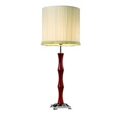 a red lamp with a white shade on it