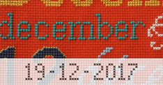 a cross stitch pattern with the words december written in white and blue on red background