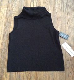 Women's Josephine Chaus Sleeveless blac turtleneck sweater with a hint of sparkle. Size:M Chest: 34 Length:22 58% acrylic 27% nylon 10% polyester 5% metallic New with tags!!!! ****PLEASE READ ALL TERMS**** ****I ACCEPT PAYPAL ONLY**** ***ALL ITEMS SOLD FROM A SMOKE FREE HOME~WE HAVE A KITTY BUT SHE DOES NOT GO WHERE EBAY ITEMS ARE STORED*** ***ALL ITEMS SOLD AS IS NO RETURNS!!!!!*** ***ANY QUESTIONS PLEASE ASK BEFORE BIDDING*** ***THANK YOU FOR LOOKING AND HAVE A WONDERFUL DAY!!!!*** :) Fitted Sleeveless Black Sweater, Fitted Black Sleeveless Sweater, Black Fitted Sleeveless Sweater, Fitted Turtleneck Sweater Vest For Fall, Black High Neck Sweater Vest For Fall, Black Stretch Turtleneck Sweater Vest, Black Turtleneck Knit Sweater Vest, Fitted High Neck Sweater Vest For Fall, High Neck Stretch Sweater Vest For Winter