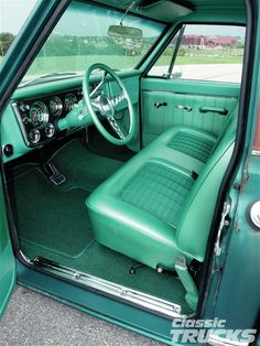 the interior of an old green car is clean and ready to be used for restoration