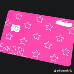 a pink credit card with white stars and the word girl on it, in front of a black background