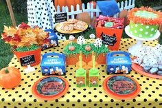 a table topped with lots of food and decorations