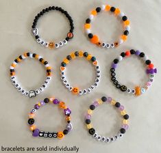 six bracelets with different designs on them are shown in the shape of letters and numbers