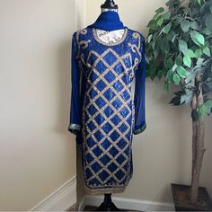 Have A Indian Or Pakistani Wedding Event Coming Up And Need An Ethnic, Exotic Outfit? Look No Further With This Gorgeous 3 Piece Outfit That Consists Of A Top (Kameez), Bottom (Salwar) And Shawl (Dupatta). Top (Kameez) Has Sheer Long Sleeves Sleeves With A Jacquard Green And Gold Trim. The Front Has Criss Cross Detail In Gold With Stones, Sequins, Beads. Falls Slightly Below Knees. The Top Is Sheer And Overlays A Jacquard Layer. Size Large (Aka Size 42). Pants Are Royal Blue With A Floral Blue Print. The Last Of Waist. A Couple Of Pulls Near The Lower Thigh That Won’t Show Once The Entire Outfit Is On (See 2nd To Last Pic). Shawl (Dupatta) Is Sheer Royal Blue With A Jacquard Border. Semi-stitched Embellished Salwar Kameez For Transitional Season, Transitional Semi-stitched Embellished Salwar Kameez, Fitted Embellished Salwar Kameez With Straight Kurta, Bollywood Style Embellished Straight Kurta Salwar Kameez, Bollywood Style Embellished Long Sleeve Salwar Kameez, Bollywood Style Embellished Fitted Kurta, Fitted Blue Traditional Wear For Diwali, Blue Dabka Salwar Kameez For Wedding, Blue Salwar Kameez With Dabka For Wedding