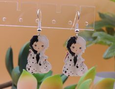 Earrings are handmade and may have small variations due to this. I do not own, nor did I create these images. They are the amazing work of HandMek. Check out their other works on Etsy! This product is not affiliated with any copyright owner. Unique White Plug Earrings As Gift, Handmade White Dangle Plug Earrings, Whimsical White Hand Painted Earrings, Wire Earrings, Unique Hand Painted White Earrings, The Amazing, Artistic White Drop Earrings, Jewelry Earrings Dangle, Artistic White Nickel-free Earrings