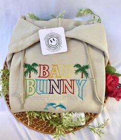 We are so happy you are here! Shop our Bad Bunny Worlds Hottest Tour Embroidered Hoodie - Un Verano Sin Ti Bad Bunny Merch See other listing for hoodie :) ALL Items are made to order, thank you so much for you patience. Please DM us if you have any questions we are happy to help. **PROCESSING 10-14 BUSINESS DAYS (weekends not included) Shipping takes 4-6 days once order in complete. This UNISEX sweater is available in various other colors! Our Crewnecks are perfect for those late summer nights a Late Summer Nights, Bad Bunny Merch, Bunny Hoodie, Urban Music, Cozy Night, Unisex Sweater, Make Happy, Embroidered Hoodie, Bad Bunny