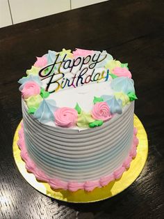 a birthday cake sitting on top of a wooden table