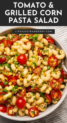 a white bowl filled with pasta and tomatoes