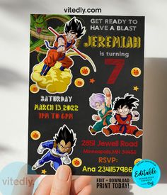 a hand holding up a dragon ball birthday card