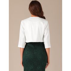 This jacket features an open front design that effortlessly drapes over your silhouette. The lapel collar adds a touch of elegance and professionalism, making it perfect for business and office wear. The cropped length of the jacket gives it a modern and trendy twist, allowing you to pair it with high-waisted pants, skirts, or dresses for a fashion-forward look. The classic fit silhouette enhances your figure without compromising comfort. Made from quality materials, this jacket is lightweight a Tailored Elegant Spring Cardigan, Elegant Tailored Spring Cardigan, Elegant Fitted Cardigan For Work, Tailored Spring Cardigan For Formal Occasions, Elegant Formal Open Front Outerwear, Elegant Open Front Blazer, Elegant Open Front Shrug For Spring, White Elegant Formal Cardigan, Fitted Open Front Elegant Blazer