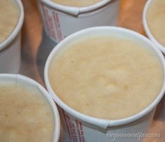 several cups of food sitting on top of a table