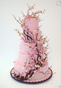 a pink wedding cake with music notes on it