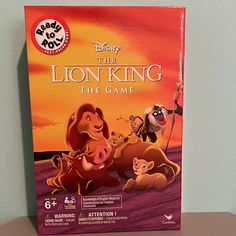 the lion king board game sits on a table