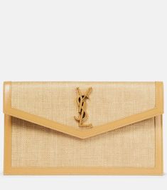 Uptown leather-trimmed raffia clutch in neutrals - Saint Laurent | Mytheresa Luxury Beige Envelope Clutch, Designer Beige Clutch With Gold-tone Hardware, Parisian Glamour, Saint Laurent Clutch, Raffia Clutch, Saint Laurent Bag, Fabric Trim, Leather Clutch, Leather Trims