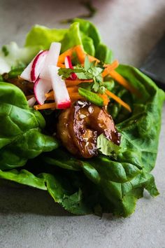 lettuce, carrots, radishes and other vegetables on a plate