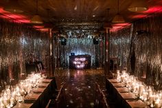 a long table with many candles on it