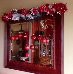 a mirror that has some ornaments on it