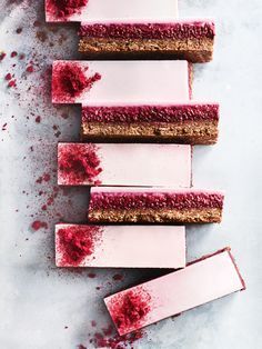 five pieces of cake with red icing on them