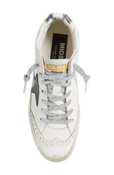 Signature scuffed-up detailing accentuates the sparkly laces of a leather sneaker punctuated with perforated eyelets. Lace-up style Leather upper and lining/rubber sole Made in Italy Women's Designer Shoes Silver High-top Sneakers With Perforations, Silver High-top Sneakers With Laces, Lace-up High-top Sneakers With Perforations, Golden Goose Mid Star, Golden Goose Mid, Star Sneakers, Footwear Design Women, Golden Goose, Up Styles