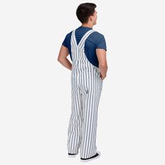 Show your team spirit in these stylish and comfortable New York Yankees Men's Pinstripe Bib Overalls. With their all-over team-colored design and bold team logo display, these overalls are the perfect way to show your support for the New York Yankees while showing off some pinstriped style that will go great with your team jersey and the rest of your team gear. The bib pocket is perfect for storing your phone, wallet, or other essentials, and the adjustable bib shoulder straps ensure a comfortab Striped Cotton Overalls, Logo Display, Team Gear, Team Jersey, Bib Overalls, New York Mets, Major League Baseball, Phone Wallet, New York Yankees