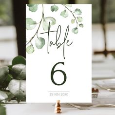 the table numbers are displayed with greenery