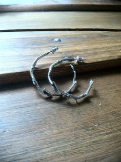 "Cast twigs formed into hoop earrings measuring 1.25\". Beautiful and light weight, great for any occasion. All of my jewelry is handmade exclusively by me and will be wrapped and shipped out ready to enjoy for yourself or to be given as a gift.. Thank you for your support. See all the pieces in my shop here... http://www.etsy.com/shop/lovelightjewelry" Silver Nature-inspired Hoop Earrings As Gift, Silver Nature-inspired Hoop Earrings For Gift, Handmade Nature-inspired Round Hoop Earrings, Handmade Nature-inspired Hoop Earrings, Handmade Small Hoop Earrings, Nature-inspired, Handmade Small Hoop Earrings Nature-inspired, Handmade Small Hoop Nature-inspired Earrings, Handmade Small Nature-inspired Hoop Earrings, Silver Wire Earrings