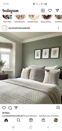 a bed sitting in a bedroom next to a window with pictures on the wall above it