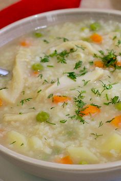 a white bowl filled with soup on top of a table